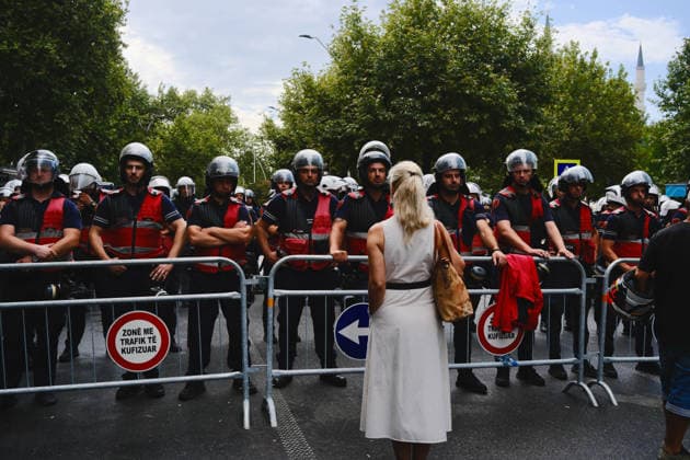 July 27, 2026, U.S.: An Albanian woman stands before police outside of a parliament meeting in Tirana, Albania, on the 57th day of the Flamingo Revolution against Prime Minister EDI RAMA s government. U.S.  - ZUMAm354 20260727_znp_m354_009 Copyright: xMadiganxMurphyx