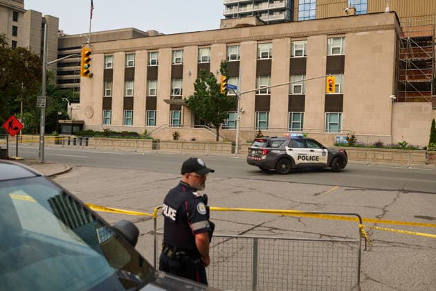 July 27, 2026, Toronto, On, Canada: Police work the scene of an early morning shooting outside the U.S. Consulate in Toronto on Monday, July 27, 2026. Toronto Canada  - ZUMAc35_ 20260727_zaf_c35_004 Copyright: xSammyxKoganx