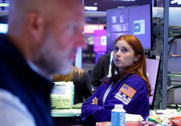 Traders work on the floor of the New York Stock Exchange on Wall Street on Monday, July 27, 2026 in New York City. The DOW began the day up over 600 points before falling back a bit but chip stocks. There was a pause in Iran fighting over the weekend.  NYP20260727110 JOHNxANGELILLO