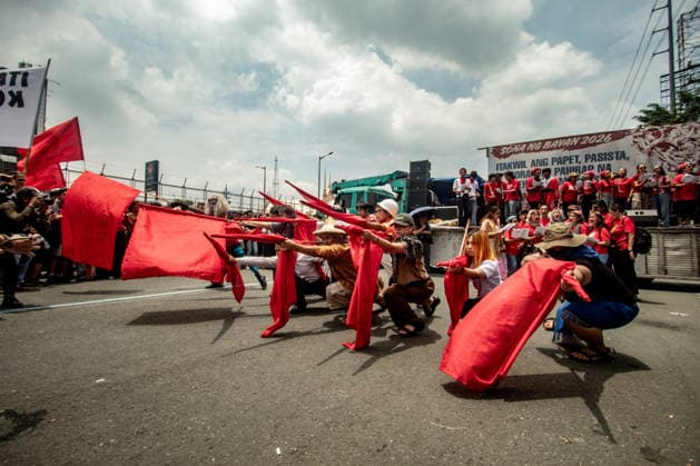 July 27, 2026, Quezon, Metro Manila, Philippines: Numbering in the thousands, multi-sectoral groups marched along Commonwealth Avenue for the Ã¢â‚¬ËœPeopleÃ¢â‚¬â ¢s SONAÃ¢â‚¬â ¢, coinciding with the 5th State of the Nation Address of Pres. Ferdinand Marcos Jr., July 27. Protesters called for greater accountability amidst government impunity, and the rejection of imperialist control of the United States over the Philippines in face of projects such as the Pax Silica Initiative which threatens to intensify issues of displacement and large-scale mining in the country. Quezon Philippines  - ZUMAs383 20260727_zip_s383_012 Copyright: xNathanielxSorianox