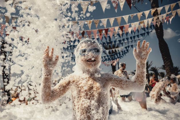 July 27, 2026, Fornells, Menorca Balearic Islands, Spain: Children get covered in foam as they participate in a foam party looking for some refreshment during the traditional Sant AntoniFestival in Fornells Fornells Spain  - ZUMAo105 20260727_fap_o105_006 Copyright: xMatthiasxOesterlex