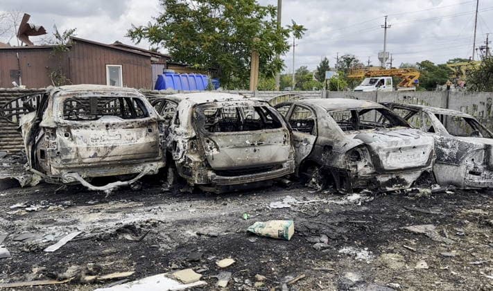 RUSSIA, ZAPOROZHYE REGION - JULY 27, 2026: Burnt-out cars are seen following a Ukrainian drone strike on Kirilovka. Zaporozhye Region Governor Press Office TASS  95541141