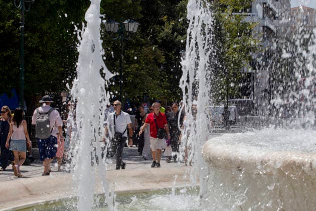 Athens Greece Heatwave People walk past a fountain in Syntagma Square in Athens, Attica, Greece on July 27, 2026. High temperatures continue across parts of Greece during the summer season. Athens Attica Greece Copyright: xElvisxTakahashixMantellox