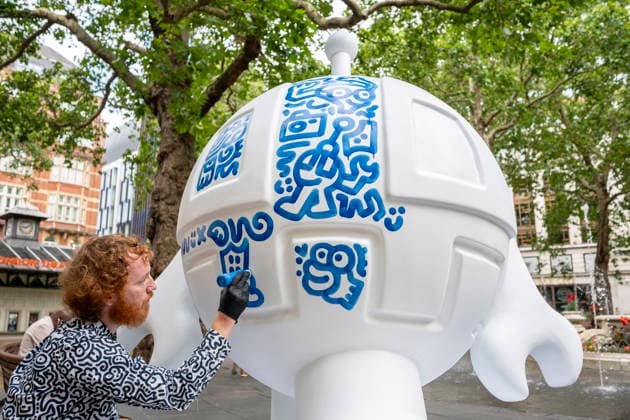 July 28, 2026, London, London, UK: LONDON, UK. Ã¢â‚¬ËœBlue RobotÃ¢â‚¬â ¢ is created in Leicester Square. Art of London launches Mr DoodleÃ¢â‚¬â ¢s Doodle Discovery, a free art trail featuring a live doodling workshop and five specially commissioned sculptures across LondonÃ¢â‚¬â ¢s West End by internationally acclaimed artist Sam Cox, known professionally as Mr Doodle (pictured). The public art experience is on display until 30 August 2026. London UK  - ZUMAl94_ 20260728_zaf_l94_010 Copyright: xStephenxChungx