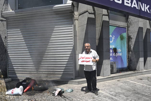 Depositors protest frozen savings at banks in Lebanon BEIRUT, LEBANON - JULY 28: People, who are unable to withdraw their money after all foreign currency deposit accounts in the country were frozen in 2019 to prevent the depletion of foreign exchange reserves, stage a protest in Beirut, Lebanon on July 28, 2026. Houssam Shbaro Anadolu Beirut Lebanon. Editorial use only. Please get in touch for any other usage.  Copyright: x2026xAnadoluxHoussamxShbarox