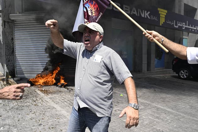Depositors protest frozen savings at banks in Lebanon BEIRUT, LEBANON - JULY 28: People, who are unable to withdraw their money after all foreign currency deposit accounts in the country were frozen in 2019 to prevent the depletion of foreign exchange reserves, stage a protest in Beirut, Lebanon on July 28, 2026. Houssam Shbaro Anadolu Beirut Lebanon. Editorial use only. Please get in touch for any other usage.  Copyright: x2026xAnadoluxHoussamxShbarox
