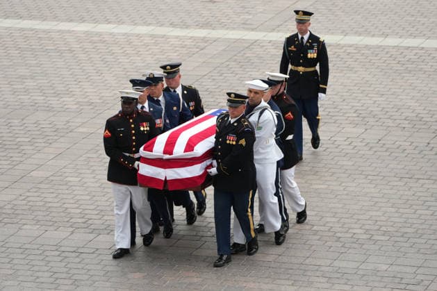 An Armed Forces Body Bearer Team moves the casket of Sen. Lindsey Graham, R-S.C., upon arrival for a Congressional tribute in the Rotunda of the U.S. Capitol, Tuesday, July 28, 2026, in Washington. Graham, who served in Congress for 31 years, died on July 11 at the age of 71. Pool photo by Mark Schiefelbein  WAX20260728706 MarkxSchiefelbein