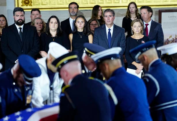 Family members watch as an Armed Forces Body Bearer Team moves the casket of Sen. Lindsey Graham, R-SC, into the Rotunda for a Congressional tribute in the Rotunda of the U.S. Capitol in Washington DC on Tuesday, July 28, 2026. Graham, who served in Congress for 31 years, died on July 11 at the age of 71.  WAP20260728910 BONNIExCASH