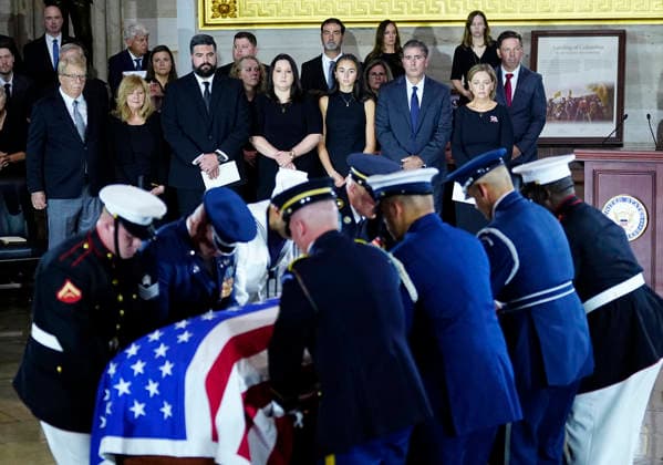 Family members watch as an Armed Forces Body Bearer Team moves the casket of Sen. Lindsey Graham, R-SC, into the Rotunda for a Congressional tribute in the Rotunda of the U.S. Capitol in Washington DC on Tuesday, July 28, 2026. Graham, who served in Congress for 31 years, died on July 11 at the age of 71.  WAP20260728911 BONNIExCASH