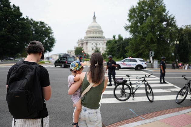 July 28, 2026, Washington, District Of Columbia, USA: People gather near at the U.S. Capitol as a motorcade and a hearse carrying the casket of U.S. Senator Lindsey Graham (R-SC) arrives for a memorial service in Washington, D.C. on July 28, 2026. Washington USA - ZUMAd227 20260728_znp_d227_017 Copyright: xBryanxDozierx