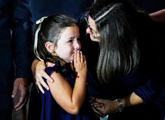 A young family member is comforted during a Congressional Tribute to honor the late Sen. Lindsey Graham in the Rotunda of the U.S. Capitol in Washington DC on Tuesday, July 28, 2026. Graham, who served South Carolina in Congress for 31 years, died on July 11 at the age of 71.  WAP20260728947 BONNIExCASH