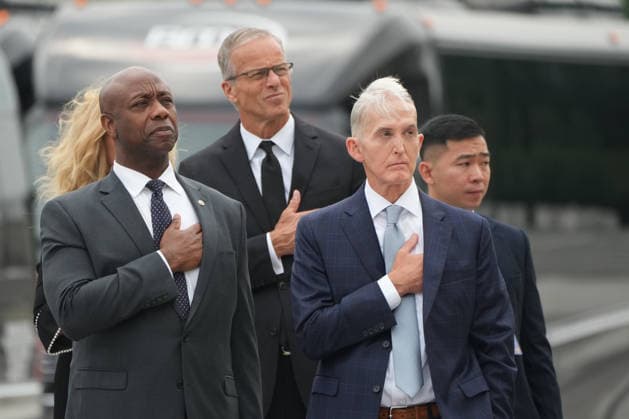 Sen. Tim Scott, R-S.C., Senate Majority Leader John Thune, R-S.D., and former Rep. Trey Gowdy, R-S.C., watch as an Armed Forces Body Bearer Team moves the casket of Sen. Lindsey Graham, R-S.C., from the U.S. Capitol after a congressional tribute in the Rotunda Tuesday, July 28, 2026, in Washington, DC. Pool  WAX20260728202 MarkxSchiefelbein