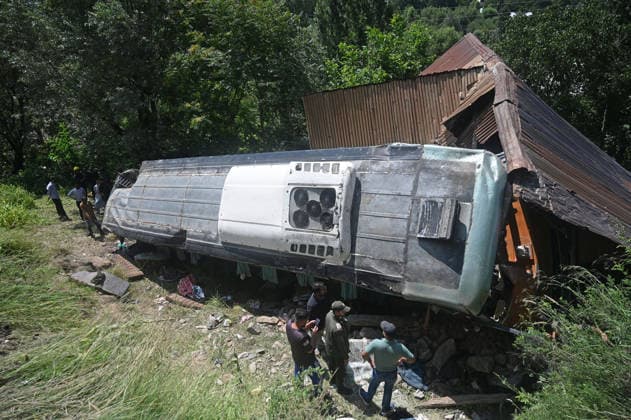 GANDERBAL, INDIA - JULY 28: A heavily damaged bus carrying Amarnath Yatra pilgrims rests along a steep embankment after skidding off the road and plunging into a deep gorge at the S-Mode stretch near Hariganiwan in the Gund area on July 28, 2026 in Ganderbal, India. The bus carrying around 40 pilgrims returning from the Baltal base camp toward Srinagar after performing darshan at the holy cave shrine, lost control while negotiating a treacherous curve. At least 39 pilgrims hailing from Madhya Pradesh, Rajasthan, and Delhi sustained injuries in the crash, which brought a swift multi-agency rescue operations. (Photo by Waseem Andrabi Hindustan Times) 39 Injured After Bus Carrying Amarnath Pilgrims Skids In Ganderbal