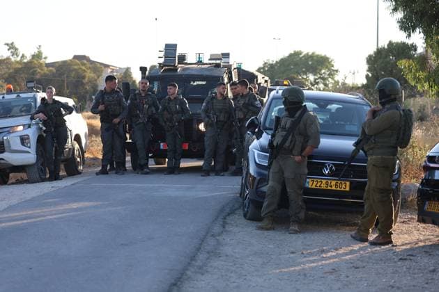 July 28, 2026, Umm Al-Khair, Palestine, State of: UMM AL-KHAIR, West Bank Ã¢â‚¬ July 28, 2026: Israeli soldiers and settlers gather near the site of a memorial ceremony marking the first anniversary of the death of Palestinian activist Odeh Al-Hathaleen in the village of Umm al-Khair, Masafer Yatta, south of Hebron, in the occupied West Bank, on July 28, 2026. During the incident, Israeli forces assaulted Israeli Knesset member Ofer Cassif. Umm Al-Khair Palestine, State of - ZUMAq101 20260728_zna_q101_097 Copyright: xMosabxShawerx