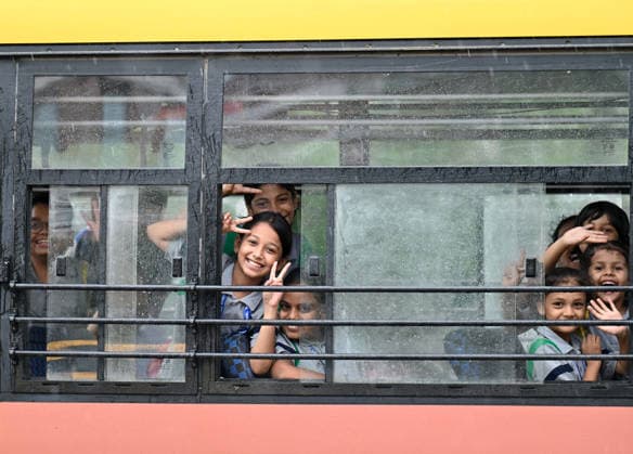 GURUGRAM, INDIA - JULY 28: Children are seen enjoying the rain showers on Sheetla Mata Road near Sukhrali Chowk on July 28, 2026 in Gurugram, India. (Photo by Parveen Kumar Hindustan Times) Heavy Rains Inundates Gurugram