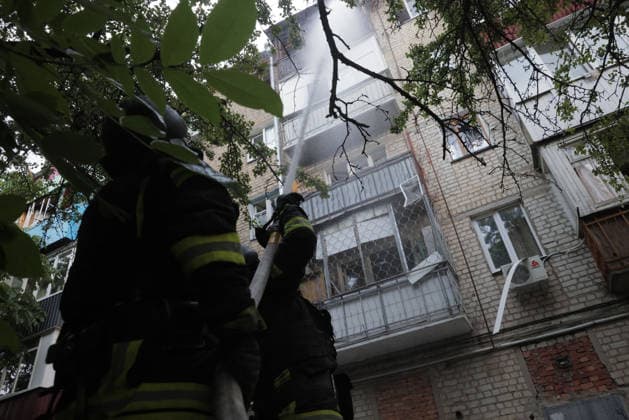 Shahed Drone Strike - Kharkiv A Ukrainian firefighter directs a water jet at a burning upper floor of a five-storey residential building in the Novobavarski district of Kharkiv, Ukraine, on July 28, 2026, after a russian Shahed-type strike drone hit the building, igniting the roof and upper floors; all residents were evacuated and two casualties were reported as emergency crews worked to extinguish the fire and mitigate the aftermath of the attack. Photo by Titov Yevhen ABACAPRESS.COM Kharkiv Kharkiv Oblast Ukraine  Copyright: xTitovxYevhen ABACAx