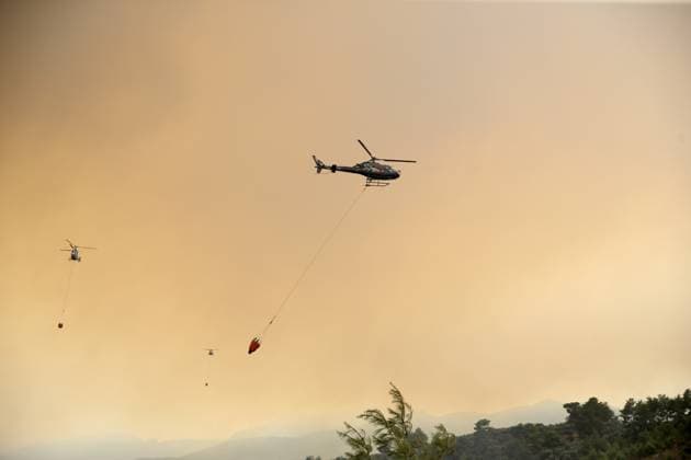 Firefighters battle wildfire in Mugla from air and ground MUGLA, TURKIYE - JULY 29 : Fire extinguishing efforts continue both from the air and land to contain a wildfire in the Seydikemer district of Mugla, Turkiye on July 29, 2026. Ali Riza Akkir Anadolu Mugla Turkey. Editorial use only. Please get in touch for any other usage.  Copyright: x2026xAnadoluxAlixRizaxAkkirx