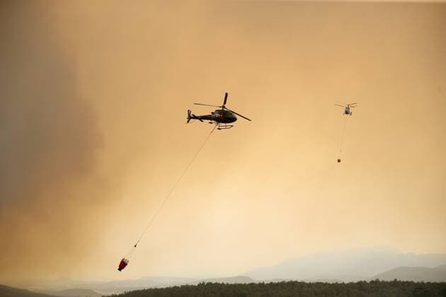 Firefighters battle wildfire in Mugla from air and ground MUGLA, TURKIYE - JULY 29 : Fire extinguishing efforts continue both from the air and land to contain a wildfire in the Seydikemer district of Mugla, Turkiye on July 29, 2026. Ali Riza Akkir Anadolu Mugla Turkey. Editorial use only. Please get in touch for any other usage.  Copyright: x2026xAnadoluxAlixRizaxAkkirx