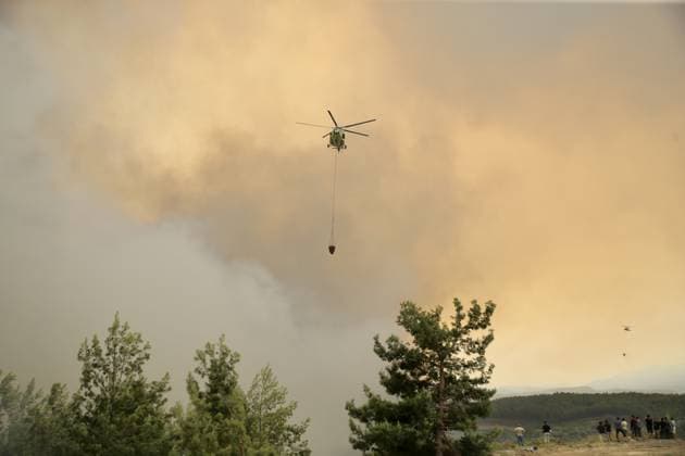 Firefighters battle wildfire in Mugla from air and ground MUGLA, TURKIYE - JULY 29 : Fire extinguishing efforts continue both from the air and land to contain a wildfire in the Seydikemer district of Mugla, Turkiye on July 29, 2026. Ali Riza Akkir Anadolu Mugla Turkey. Editorial use only. Please get in touch for any other usage.  Copyright: x2026xAnadoluxAlixRizaxAkkirx