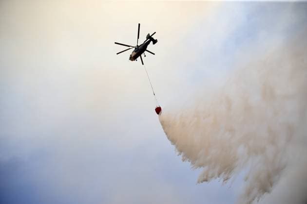Firefighters battle wildfire in Mugla from air and ground MUGLA, TURKIYE - JULY 29 : Fire extinguishing efforts continue both from the air and land to contain a wildfire in the Seydikemer district of Mugla, Turkiye on July 29, 2026. Ali Riza Akkir Anadolu Mugla Turkey. Editorial use only. Please get in touch for any other usage.  Copyright: x2026xAnadoluxAlixRizaxAkkirx