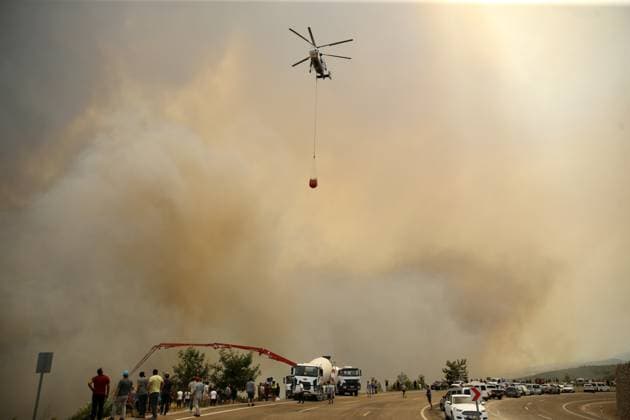 Firefighters battle wildfire in Mugla from air and ground MUGLA, TURKIYE - JULY 29 : Fire extinguishing efforts continue both from the air and land to contain a wildfire in the Seydikemer district of Mugla, Turkiye on July 29, 2026. Ali Riza Akkir Anadolu Mugla Turkey. Editorial use only. Please get in touch for any other usage.  Copyright: x2026xAnadoluxAlixRizaxAkkirx