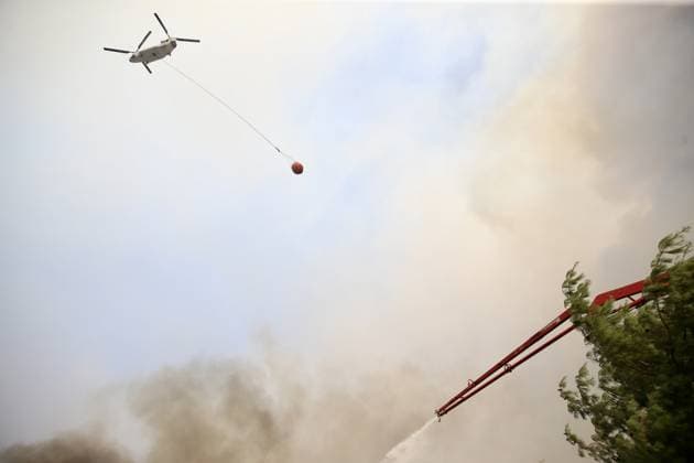 Firefighters battle wildfire in Mugla from air and ground MUGLA, TURKIYE - JULY 29 : Fire extinguishing efforts continue both from the air and land to contain a wildfire in the Seydikemer district of Mugla, Turkiye on July 29, 2026. Ali Riza Akkir Anadolu Mugla Turkey. Editorial use only. Please get in touch for any other usage.  Copyright: x2026xAnadoluxAlixRizaxAkkirx