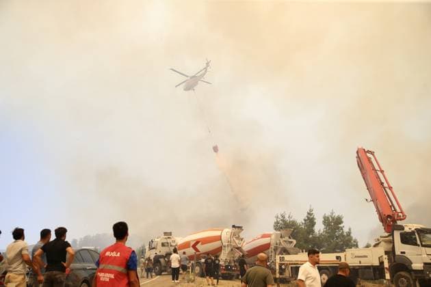 Firefighters battle wildfire in Mugla from air and ground MUGLA, TURKIYE - JULY 29 : Fire extinguishing efforts continue both from the air and land to contain a wildfire in the Seydikemer district of Mugla, Turkiye on July 29, 2026. Ali Riza Akkir Anadolu Mugla Turkey. Editorial use only. Please get in touch for any other usage.  Copyright: x2026xAnadoluxAlixRizaxAkkirx