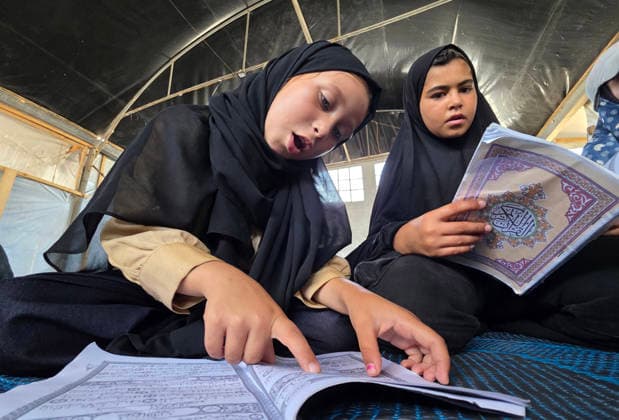 Orphaned Palestinian children attend Quran classes in Khan Younis camp Orphaned Palestinian boys and girls take part in Quran memorization and recitation classes at the Al Baraka Camp for Orphan Care in the al-Mawasi area of Khan Younis, southern Gaza Strip, on July 29, 2026. The educational sessions are held regularly to teach the Quran and strengthen the children s religious knowledge amid the difficult humanitarian conditions in the Gaza Strip. Photo by Tariq Mohammad APA Images Khan Yunis Gaza Strip Palestinian Territory 290726_Khan_Yunis_TM_00(3) Copyright: xapaimagesxTariqxMohammad xapaimagesx