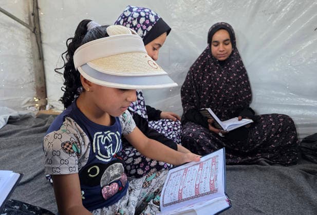Orphaned Palestinian children attend Quran classes in Khan Younis camp Orphaned Palestinian boys and girls take part in Quran memorization and recitation classes at the Al Baraka Camp for Orphan Care in the al-Mawasi area of Khan Younis, southern Gaza Strip, on July 29, 2026. The educational sessions are held regularly to teach the Quran and strengthen the children s religious knowledge amid the difficult humanitarian conditions in the Gaza Strip. Photo by Tariq Mohammad APA Images Khan Yunis Gaza Strip Palestinian Territory 290726_Khan_Yunis_TM_00(9) Copyright: xapaimagesxTariqxMohammad xapaimagesx