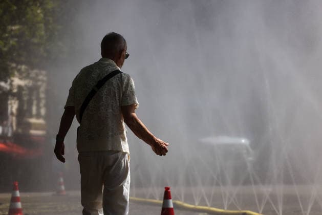 Cologne unveils cooling mist initiative as heatwave grips Germany COLOGNE, GERMANY - JULY 29: People try to cool off at Rudolfplatz Square during the Cooling Cologne initiative, where chilled groundwater was dispersed through fine mist sprays connected to fire hoses in Cologne, Germany on July 29, 2026. Organizers said the system lowered the surrounding temperature by about 12 degrees Celsius, offering relief as a heatwave swept across the region. Kadir Ilboga Anadolu Cologne Germany. Editorial use only. Please get in touch for any other usage.  Copyright: x2026xAnadoluxKadirxIlbogax