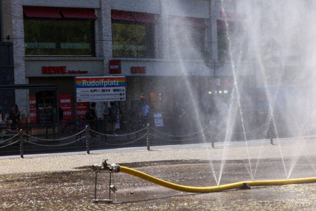 Cologne unveils cooling mist initiative as heatwave grips Germany COLOGNE, GERMANY - JULY 29: People try to cool off at Rudolfplatz Square during the Cooling Cologne initiative, where chilled groundwater was dispersed through fine mist sprays connected to fire hoses in Cologne, Germany on July 29, 2026. Organizers said the system lowered the surrounding temperature by about 12 degrees Celsius, offering relief as a heatwave swept across the region. Kadir Ilboga Anadolu Cologne Germany. Editorial use only. Please get in touch for any other usage.  Copyright: x2026xAnadoluxKadirxIlbogax