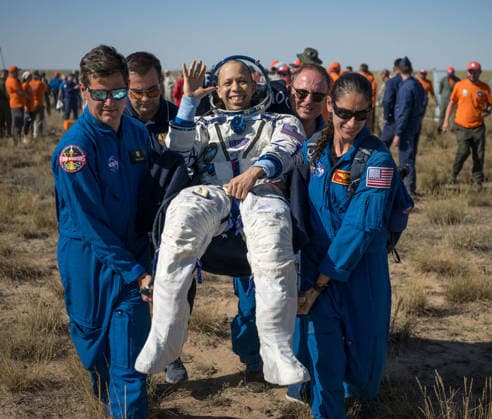 July 29, 2026, Zhezkazgan, Kazakhstan: NASA astronaut Chris Williams waves as he is carried from the Soyuz MS-28 spacecraft moments after landing, July 26, 2026 near the town of Zhezkazgan, Kazakhstan. Williams landed with cosmonauts Sergei Mikaev and Sergey Kud-Sverchkov, after 241 days in space aboard the International Space Station. Zhezkazgan Kazakhstan - ZUMAp138 20260729_zaa_p138_026 Copyright: xBillxIngalls Nasax
