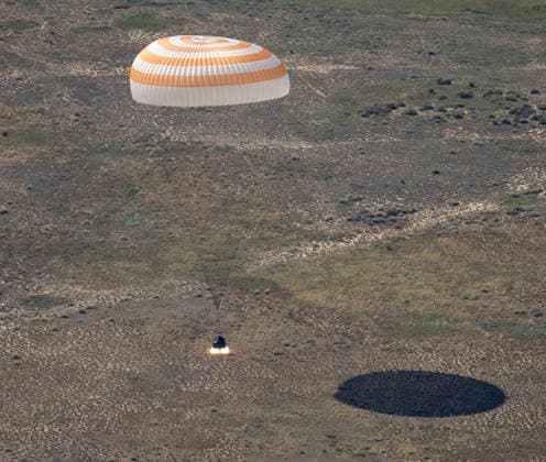 July 29, 2026, Zhezkazgan, Kazakhstan: The Soyuz MS-28 spacecraft descends for touch down on the ground after the journey back from the International Space Station, July 26, 2026 near the town of Zhezkazgan, Kazakhstan. NASA astronaut Chris Williams landed with cosmonauts Sergei Mikaev and Sergey Kud-Sverchkov, after 241 days in space aboard the International Space Station. Zhezkazgan Kazakhstan - ZUMAp138 20260729_zaa_p138_040 Copyright: xBillxIngalls Nasax