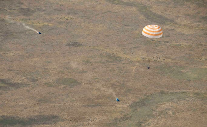July 29, 2026, Zhezkazgan, Kazakhstan: The Soyuz MS-28 spacecraft descends for touch down on the ground after the journey back from the International Space Station, July 26, 2026 near the town of Zhezkazgan, Kazakhstan. NASA astronaut Chris Williams landed with cosmonauts Sergei Mikaev and Sergey Kud-Sverchkov, after 241 days in space aboard the International Space Station. Zhezkazgan Kazakhstan - ZUMAp138 20260729_zaa_p138_047 Copyright: xBillxIngalls Nasax