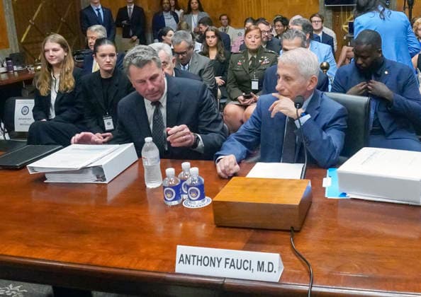 Fauci Testifies Again about the Origins of the Coronavirus Dr Anthony Fauci, former Director, National Institute of Allergy and Infectious Diseases at the National Institutes of Health (NIH), right, takes his seat at the witness table as he prepares to testify before the US Senate Committee on Homeland Security and Governmental Affairs in the Dirksen Senate Office Building on Capitol Hill in Washington, DC, USA, on Wednesday, July 29, 2026. At left Fauci attorney David Schertler sits at the witness table, even though US Senator Rand Paul, MD (Republican of Kentucky), committee chair said he was not authorized to do so. Photo by Andrew Thomas CNP ABACAPRESS.COM Washington District of Columbia United States  Copyright: xCNP ABACAx