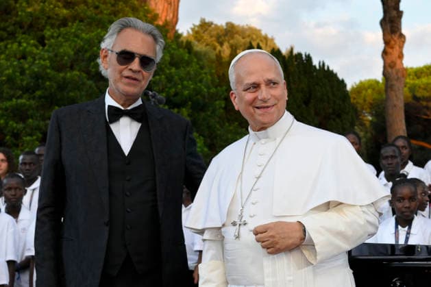 ITALY - POPE LEO XIV DURING A CONCERT IN BORGO LAUDATO SI , A 55-HECTARE EDUCATIONAL AND ENVIRONMENTAL CENTER, AT CASTEL GANDOLFO - 2026 7 29 Italy, Castel Gandolfo , Vatican, 2026 7 29 Pope Leo XIV smiles next to Italian tenor Andrea Bocelli after a concert in Borgo Laudato Si, a 55-hectare educational and environmental center, at Castel Gandolfo EDITORIAL USE ONLY - NO BOOKS Copyright: xVATICANxMEDIAx