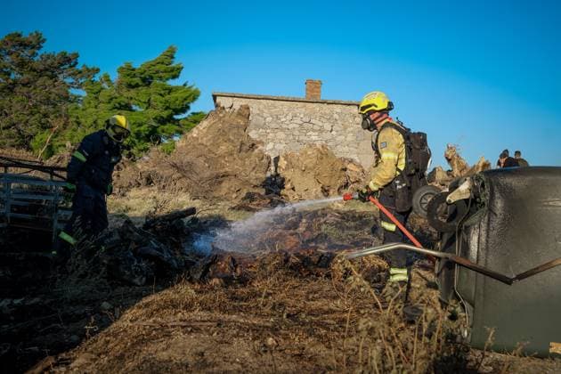 (260730) -- CRETE, July 30, 2026 -- Firefighters take part in firefighting operations in Rethymno on the island of Crete, Greece, July 29, 2026. Two firefighters lost their lives while battling a fast-moving wildfire in Rethymno on the Greek island of Crete on Wednesday, as gale-force winds fueled the blaze across a front stretching more than 15 kilometers. (Photo by Xinhua) GREECE-CRETE-WILDFIRE-FIREFIGHTERS RapanisxSpiros 