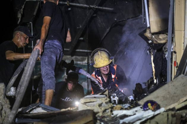 Israeli army continues attacks on civilian homes in Gaza GAZA CITY, GAZA STRIP, PALESTINE - JULY 30: Firefighters respond to a fire in a damaged building near Al-Ahli (Baptist) Hospital after an Israeli strike in eastern Gaza City, Gaza Strip, Palestine on July 30, 2026. According to local sources, the strike targeted the building near the hospital following a renewed ceasefire violation, causing damage and igniting a fire. Saeed M. M. T. Jaras Anadolu Gaza City Gaza. Editorial use only. Please get in touch for any other usage.  Copyright: x2026xAnadoluxSaeedxM.xM.xT.xJarasx