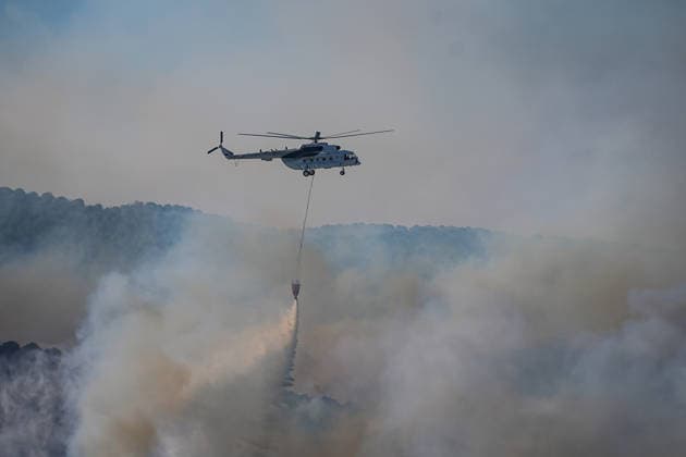 Firefighters battle forest fire for second day in Balikesir s Gomec district BALIKESIR, TURKIYE - JULY 30: Aerial and ground firefighting operations continue for a second day to contain a forest fire in the Gomec district of Balikesir, Turkiye, on July 30, 2026. Sergen Sezgin Anadolu Balikesir Turkey. Editorial use only. Please get in touch for any other usage.  Copyright: x2026xAnadoluxSergenxSezginx