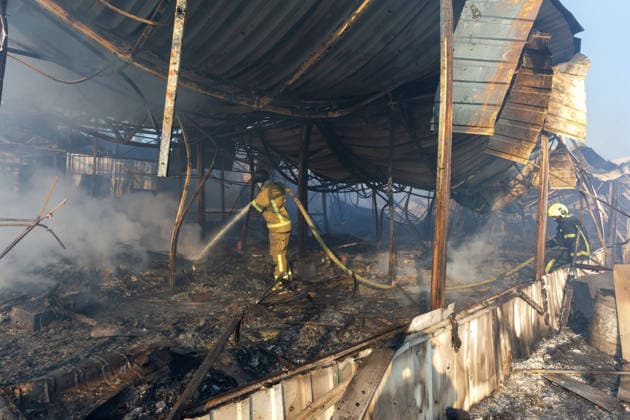 Firefighters extinguish a fire at the Antykar market in Obolonskyi district, caused by an overnight Russian missile strike, Kyiv, Ukraine, July 30, 2026. Debris fell on the market near the Pochaina metro station, igniting trading pavilions. The blaze covered an area of about 100 square metres. Traders’ goods were destroyed, leaving only burnt-out metal structures at the site. (Photo by Kyrylo Chubotin Ukrinform) Market in Kyiv catches fire due to overnight Russian attack  Copyright: xKyryloxChubotinx