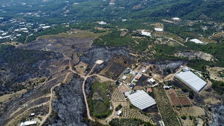 Aerial ciew reveals wildfire damage in Kumluca, Antalya ANTALYA, TURKIYE - JULY 30: An aerial view shows forested areas and buildings damaged by a wildfire that was brought under control in the Kumluca district of Antalya, on July 30, 2026 in Antalya, Turkiye. The fire left large areas of vegetation scorched and caused damage to properties in the affected region. Kasim Sakalli Anadolu Antalya Turkey. Editorial use only. Please get in touch for any other usage.  Copyright: x2026xAnadoluxKasimxSakallix