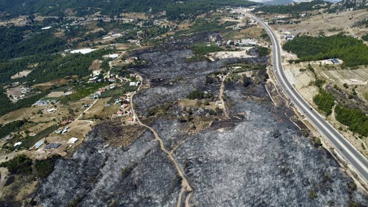 Aerial ciew reveals wildfire damage in Kumluca, Antalya ANTALYA, TURKIYE - JULY 30: An aerial view shows forested areas and buildings damaged by a wildfire that was brought under control in the Kumluca district of Antalya, on July 30, 2026 in Antalya, Turkiye. The fire left large areas of vegetation scorched and caused damage to properties in the affected region. Kasim Sakalli Anadolu Antalya Turkey. Editorial use only. Please get in touch for any other usage.  Copyright: x2026xAnadoluxKasimxSakallix