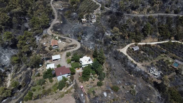 Aerial ciew reveals wildfire damage in Kumluca, Antalya ANTALYA, TURKIYE - JULY 30: An aerial view shows forested areas and buildings damaged by a wildfire that was brought under control in the Kumluca district of Antalya, on July 30, 2026 in Antalya, Turkiye. The fire left large areas of vegetation scorched and caused damage to properties in the affected region. Kasim Sakalli Anadolu Antalya Turkey. Editorial use only. Please get in touch for any other usage.  Copyright: x2026xAnadoluxKasimxSakallix