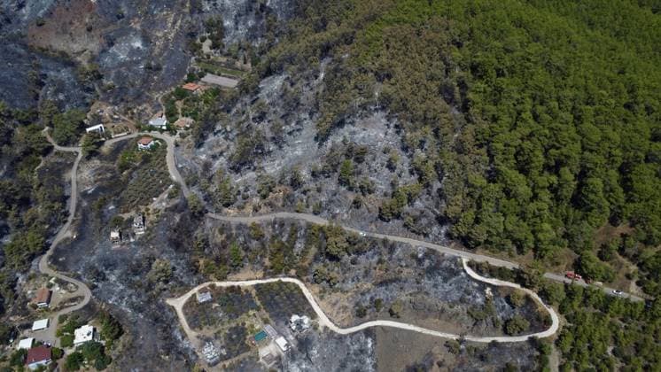 Aerial ciew reveals wildfire damage in Kumluca, Antalya ANTALYA, TURKIYE - JULY 30: An aerial view shows forested areas and buildings damaged by a wildfire that was brought under control in the Kumluca district of Antalya, on July 30, 2026 in Antalya, Turkiye. The fire left large areas of vegetation scorched and caused damage to properties in the affected region. Kasim Sakalli Anadolu Antalya Turkey. Editorial use only. Please get in touch for any other usage.  Copyright: x2026xAnadoluxKasimxSakallix