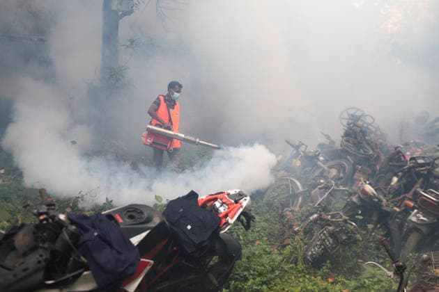 July 30, 2026, Dhaka, Dhaka, Bangladesh: A worker of the Dhaka South City Corporation sprays insecticide with a fogging machine at a dumping area in the Shahbagh police station area of Dhaka, Bangladesh, on July 30, 2026. According to the Directorate General of Health Services (DGHS), three people died from dengue and 467 patients were hospitalized with the mosquito-borne disease in the past 24 hours. Since January, the nationwide death toll has reached 53, while the total number of confirmed dengue cases has risen to 15,157. Dhaka Bangladesh - ZUMAj163 20260730_zip_j163_007 Copyright: xAbuxSufianxJewelx