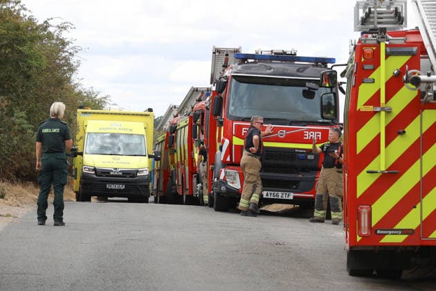 July 30, 2026, Dunwich Heath, Suffolk, UK: Dunwich Heath, UK. Emergency service workers, take a rest at a temporary head quarters, after tackling a large wildfire in Dunwich, Suffolk. The fire began on Wednesday afternoon and has been declared a major incident. Up to 90 firefighters have been tackling the blaze. Dunwich Heath UK  - ZUMAl94_ 20260730_zaf_l94_052 Copyright: xJacquelinexLawriex