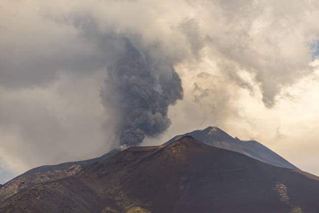 Mount Etna erupts, sending ash plume over Catania, Sicily CATANIA, ITALY - JULY 30: Mount Etna spews a column of ash after over three weeks of apparent calm on July 30, 2026 in Catania, Sicily, Italy. The activity, which began at approximately 3:30 AM local time, was characterized by intense Strombolian activity, which evolved into a lava fountain during the morning. Massive ash emission from the Voragine summit crater generated an eruption column that reached approximately 7 kilometers above sea level, dispersing west and northwest, with ashfall reported in the town of Bronte. The presence of volcanic ash prompted temporary airspace restrictions over the volcano, but operations at Catania International Airport continue regularly without in  Copyright: x2026xAnadoluxSalvatorexAllegrax