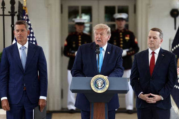US President Trump makes an announcment on veterans eligiablity for the Freedom Haulers program US Secretary of Transport Sean Duffy (L) alongside Werner Enterprises President Nathan Meisgeier (R) as US President Donald Trump (C) announces a program to allow veterans to expedite a career in commercial trucking outside the White House in Washington, DC, USA, 30 July 2026. Known as the Freedom Haulers program, the initiative would allow any US veteran who drove heavy equipment to be automatically eligible for a commercial trucking license. WASHINGTON DC United States  Copyright: xPool ABACAx