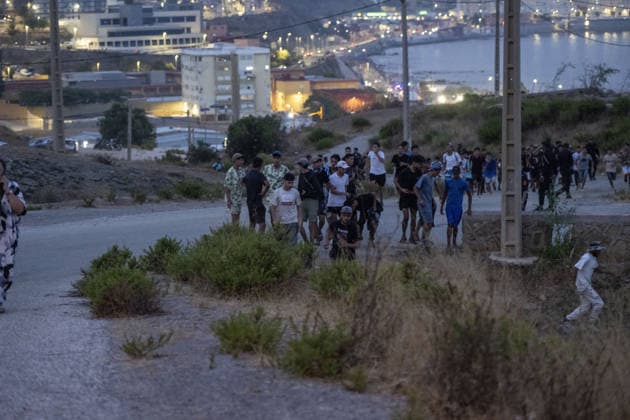 More than 800 irregular migrants intercepted while attempting to swim from Morocco to Spain s North African coast CASTILLEJOS, MOROCCO - JULY 31: Irregular migrants gather near the border area as more than 800 migrants attempting to swim from the coast of Castillejos, Morocco, to the Spanish North African enclave of Ceuta are intercepted by authorities on July 31, 2026. Some migrants are seen rushing toward the border in an attempt to enter Spanish territory. Abu Adem Muhammed Anadolu Castillejos Morocco. Editorial use only. Please get in touch for any other usage.  Copyright: x2026xAnadoluxAbuxAdemxMuhammedx
