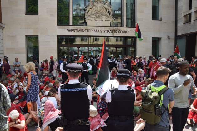 Defend Our Juries Protest in London, UK - 30 July 2026 Police officers observe protesters during the demonstration. Protesters gathered outside Westminster Magistrates Court during the so-called Graduation Day demonstration organised by Defend Our Juries against the ban on the activist group Palestine Action. London United Kingdom Copyright: xVukxValcicx xSOPAxImagesx Vuk-Valcic-1440470
